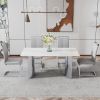 Modern minimalist dining table. Imitation marble glass sticker desktop, stainless steel legs, stable and beautiful. 4 premium PU seats